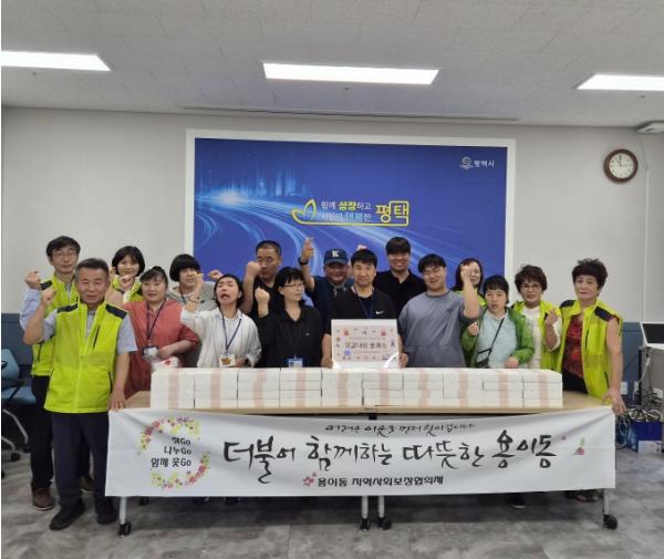 평택시 용이동 지역사회보장협의체, 발달장애인과 함께 추석맞이 떡 나눔 기사 이미지